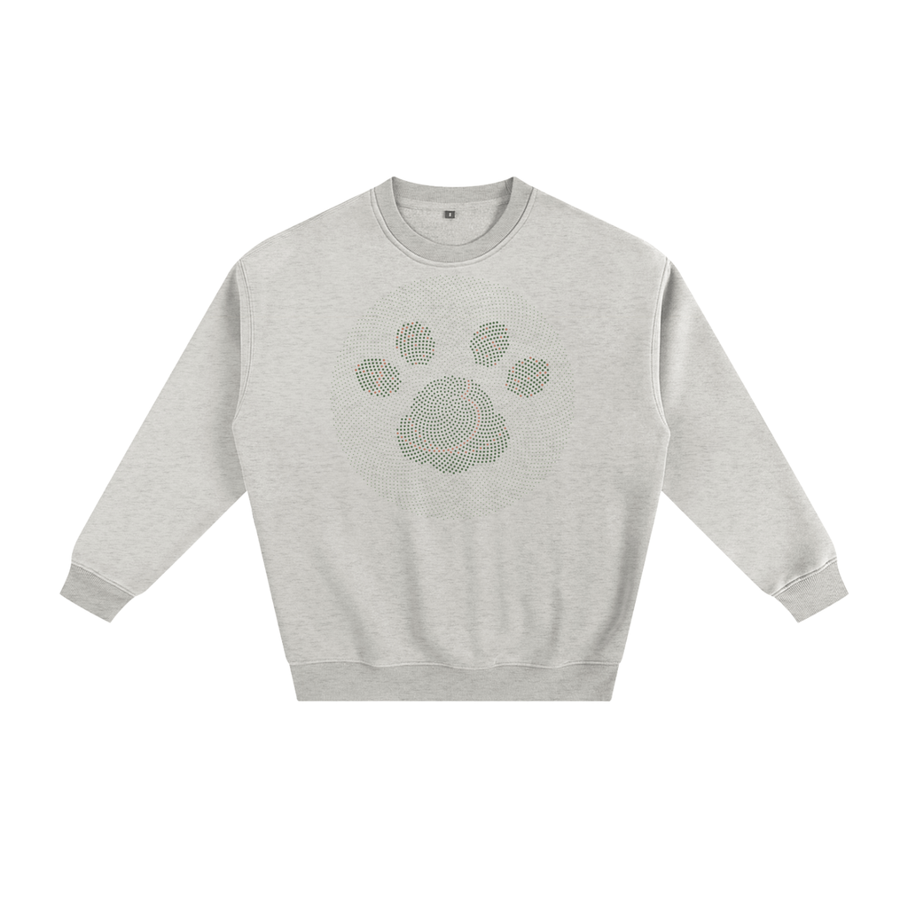 Fleece crewneck sweatshirt in Oat Gray, printed on the chest with a cat paw print made from a golden-angle spiral of green, sage and rust dots.