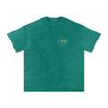 Front of a snow-washed oversized tee in Dark Green with a small line-art cat face on the left chest.