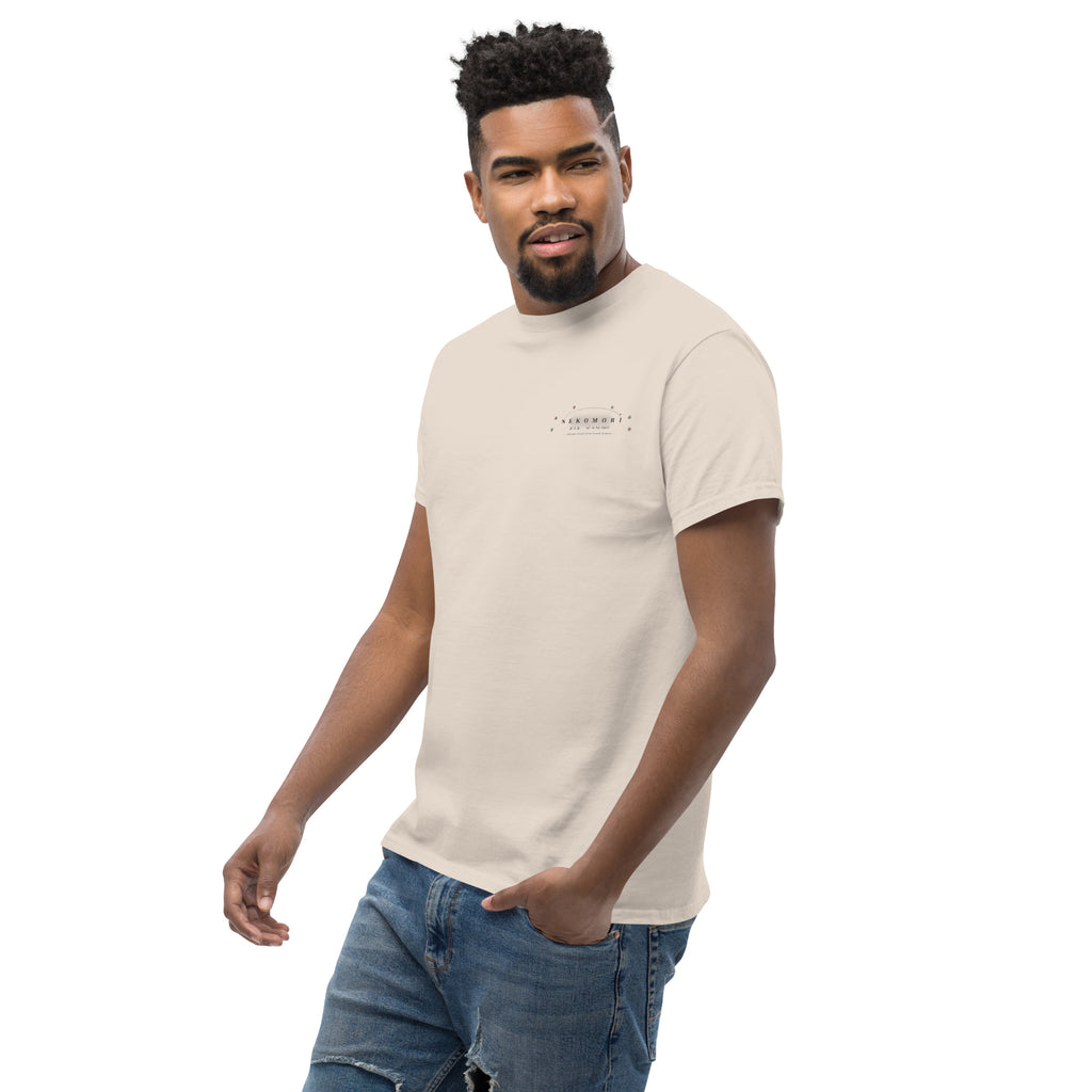 Natural Contour Cat line-art tee at a three-quarter angle from the front left, chest mark visible.