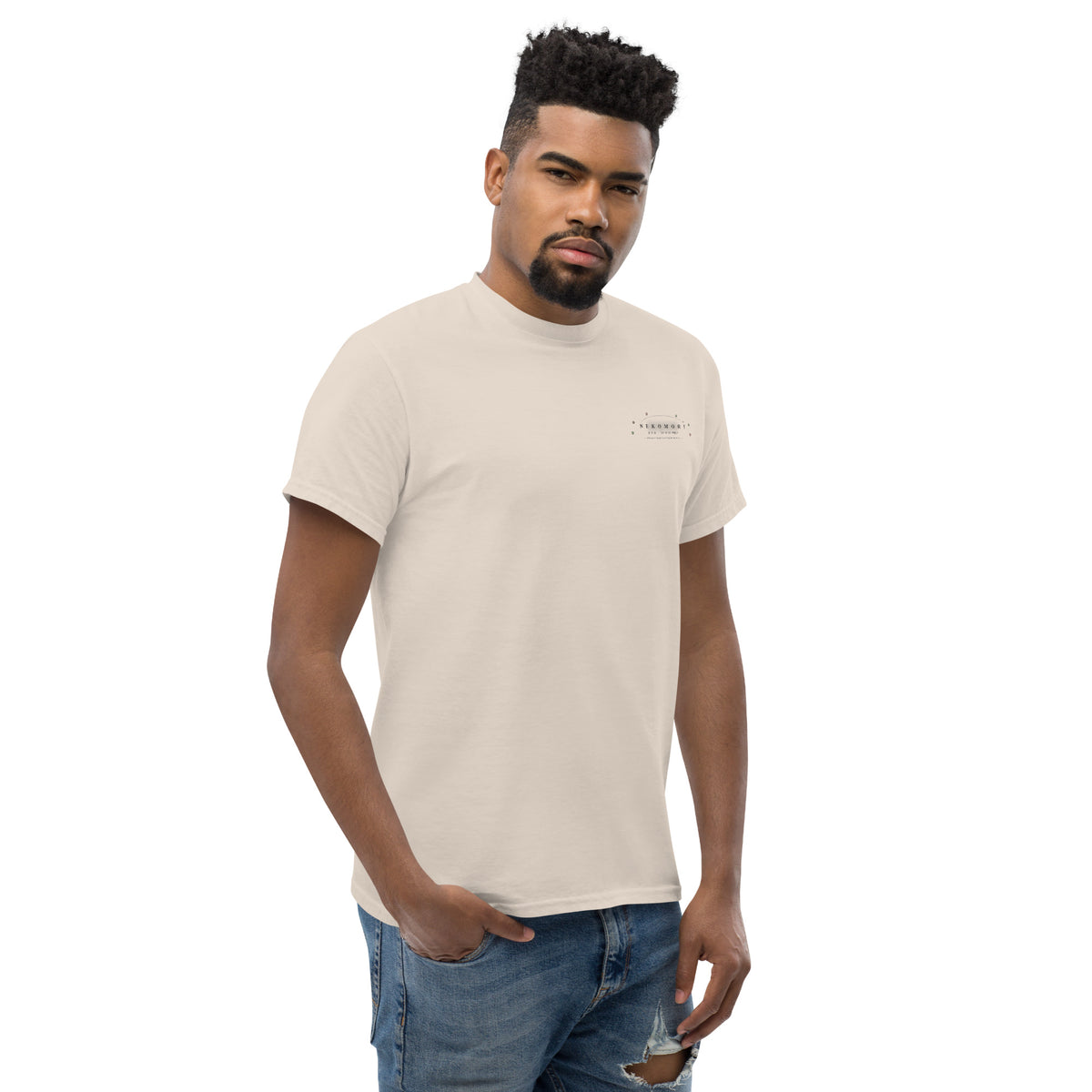 Natural Contour Cat line-art tee at a three-quarter angle from the front right, showing the ribbed collar.