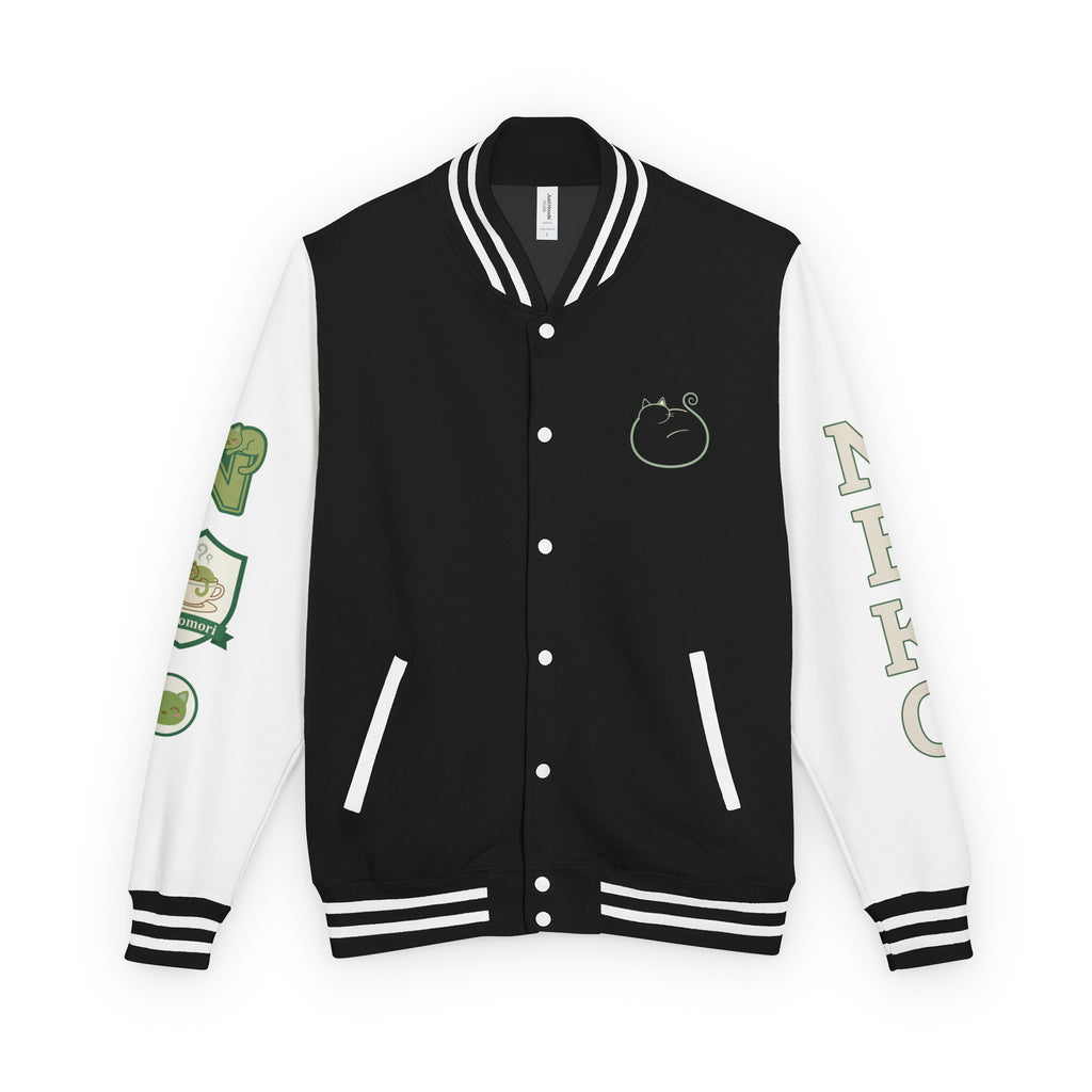 Front of the Quiet Forms letterman jacket in jet black with arctic white sleeves, showing the watercolor cat-in-a-teacup chest motif and striped ribbing.