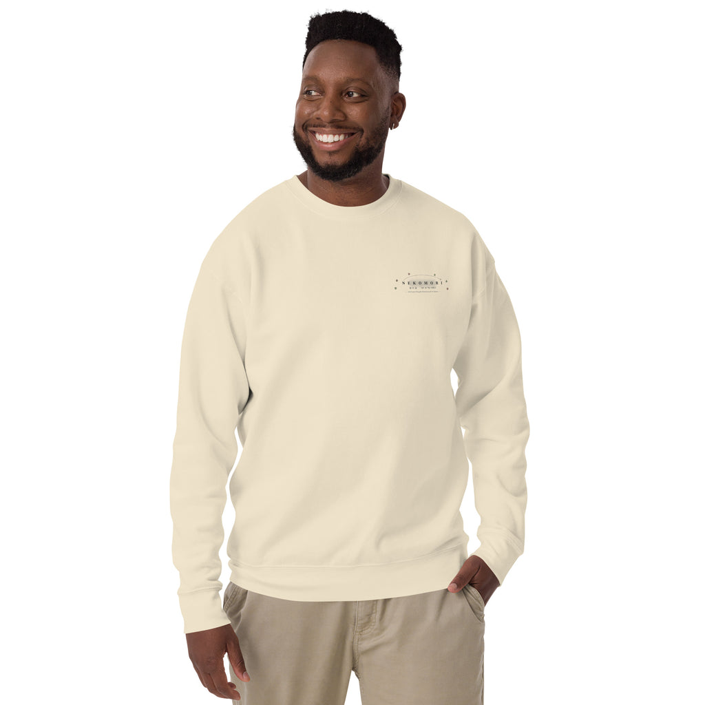 Bone unisex crewneck sweatshirt shown from the front, with Nekomori's circular contour-line cat and sprout mark at the left chest.